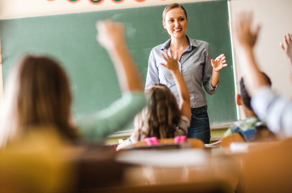 teacher helping students