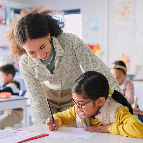 Teacher and student working on reading