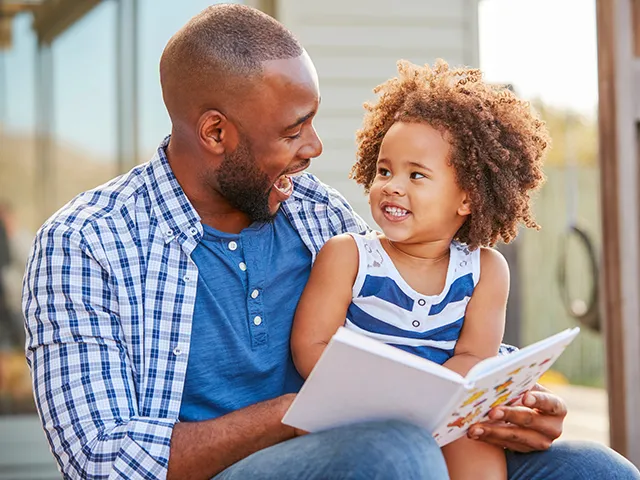 A parent reading with a child